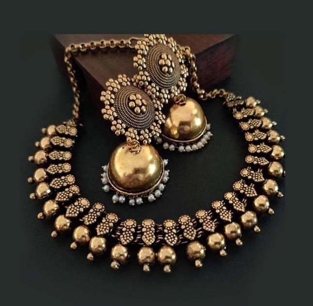Antique gold temple necklace with matching jhumka earrings